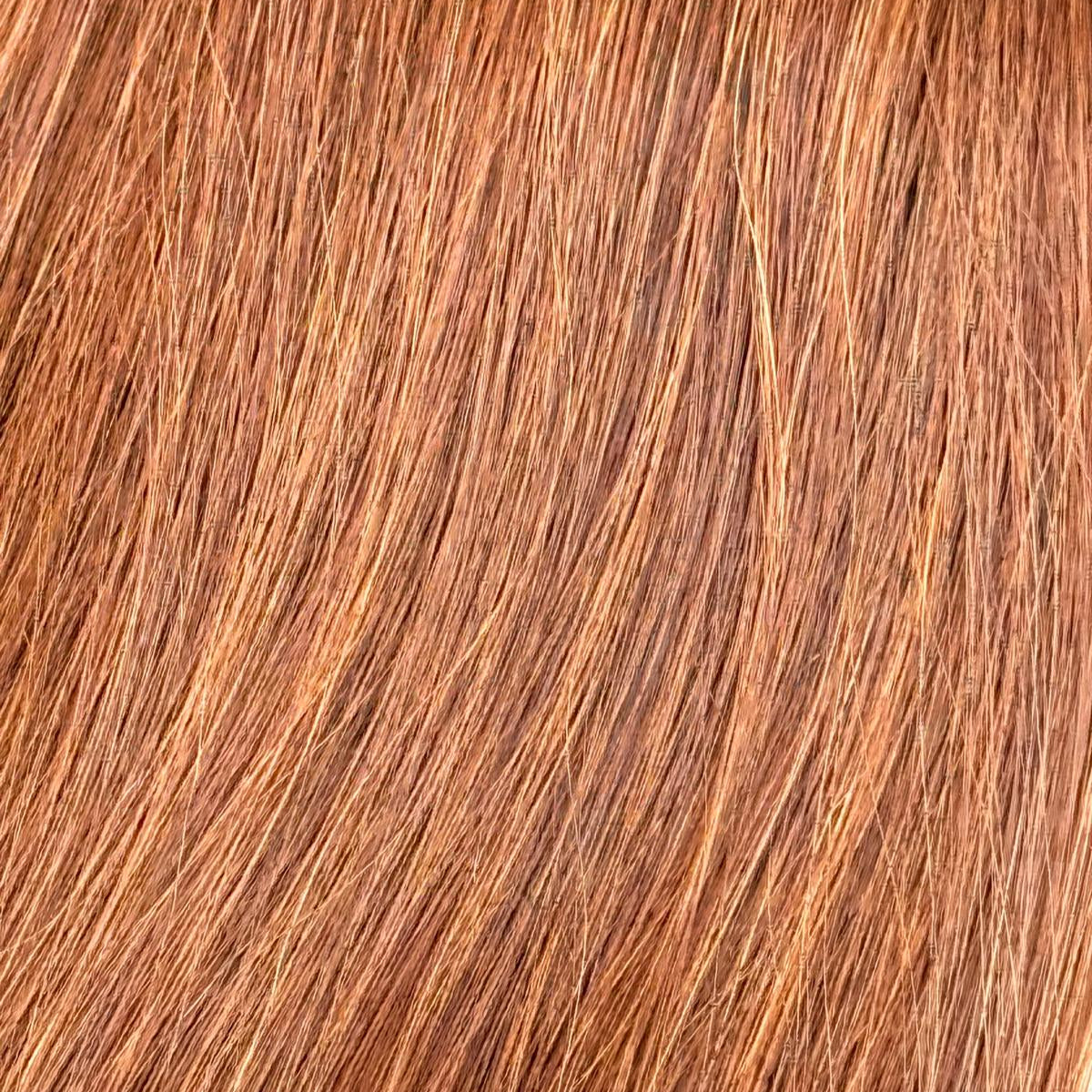 Nahaufnahme der Echthaar-Struktur von Machine Weft Tressen in Dunkelblond